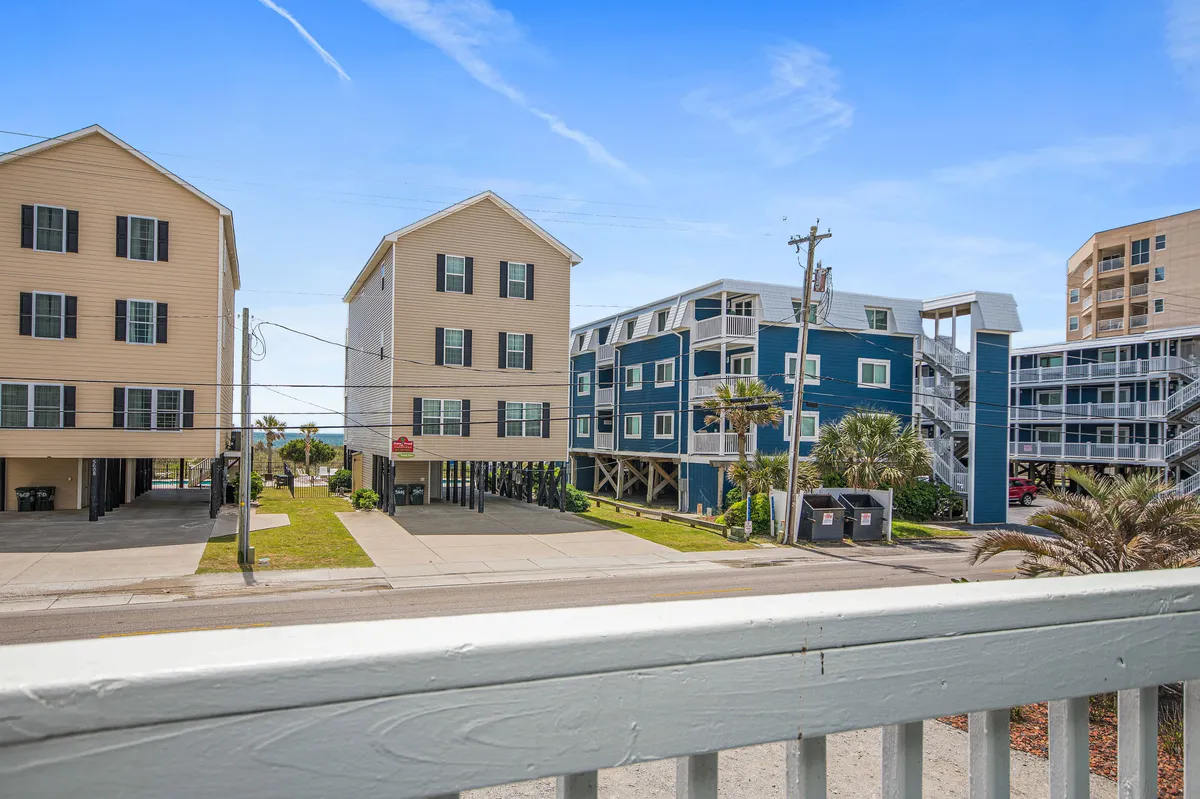 A vibrant street scene with colorful buildings and palm trees provides a sense of the lively neighborhood atmosphere just outside the home. Open space invites exploration and group adventures.